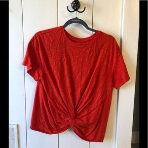 Bright orange/red top